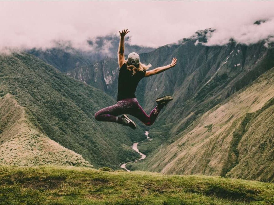 A person jumping high in spirit, symbolizing the exhilaration and freedom of overcoming anxiety on the path to personal growth